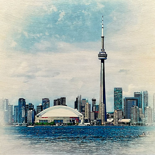 Toronto skyline art on birch wood featuring the CN Tower and waterfront, handcrafted by Alex Pyro.